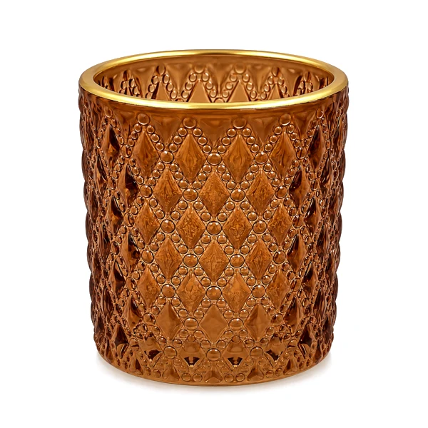 Amber diamond-patterned glass votive with a gold rim